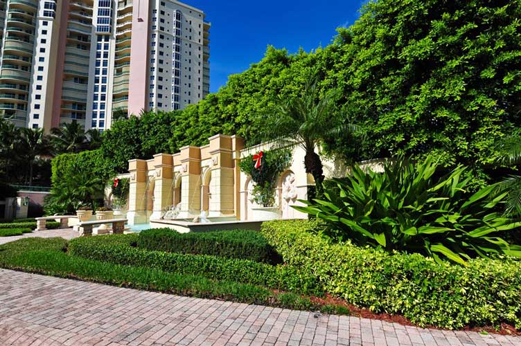 Entry feature wall along the round-about at the main entry to Cape Marco - Marco Island, Florida