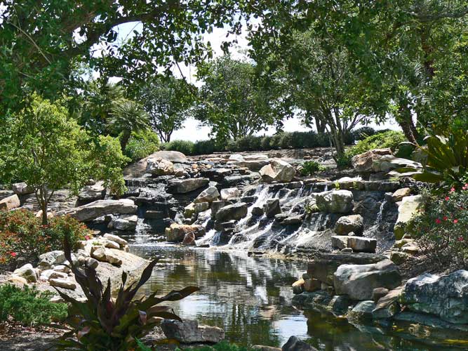 Extended naturalistic waterfall along the entry drive at the Ritz Carlton Golf Course - Sarasota, Florida