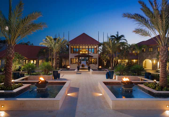 Water features at Sandals at night with fire bowls lit - Saint George, Grenada